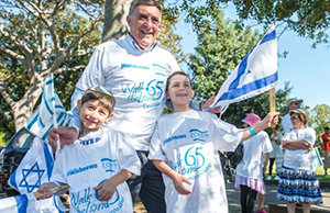 Rabbi of Or Chadash in Bondi, Sydney, Australia with kids at a kids event
