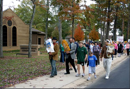 Alabama Congreation walking with Torahs