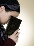 Young girl concentrating on prayer